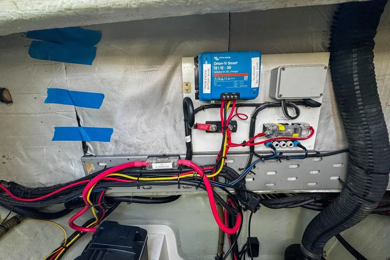 Grace Yacht Photos Pics Electrical setup in a 2016 Leopard 48 yacht, featuring wiring and a Victron Energy charger.