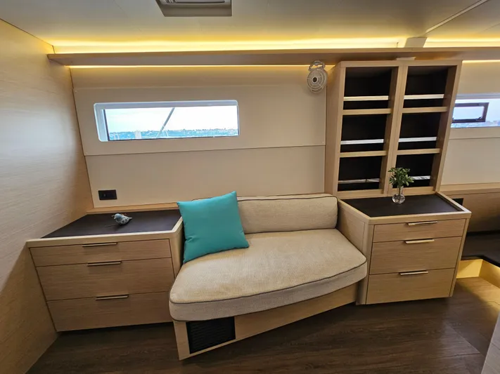  Yacht Photos Pics 2024 Lagoon 46 interior with modern seating, storage, and ambient lighting.