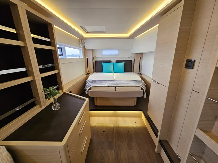  Yacht Photos Pics Luxurious interior of 2024 Lagoon 46 yacht with modern bedroom design and ambient lighting.