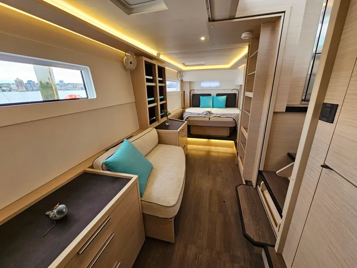  Yacht Photos Pics Luxurious interior of 2024 Lagoon 46 yacht with modern furnishings and ambient lighting.