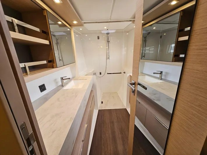 Yacht Photos Pics Luxurious bathroom interior of 2024 Lagoon 46 yacht with modern fixtures and elegant design.