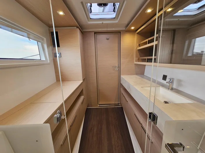  Yacht Photos Pics Luxurious interior of 2024 Lagoon 46 yacht, featuring modern wood finishes and ample natural light.