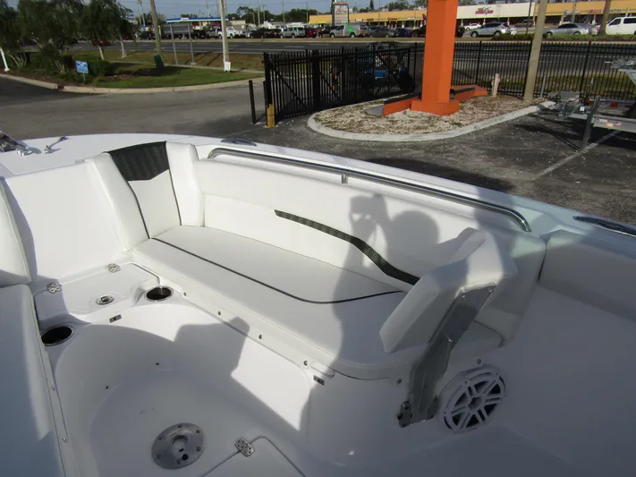  Yacht Photos Pics 2025 Wellcraft 243 Fisherman boat interior with seating and speaker.