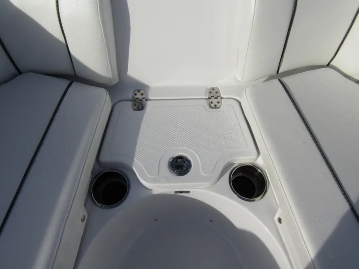  Yacht Photos Pics 2025 Wellcraft 243 Fisherman boat seating area with cup holders and storage.