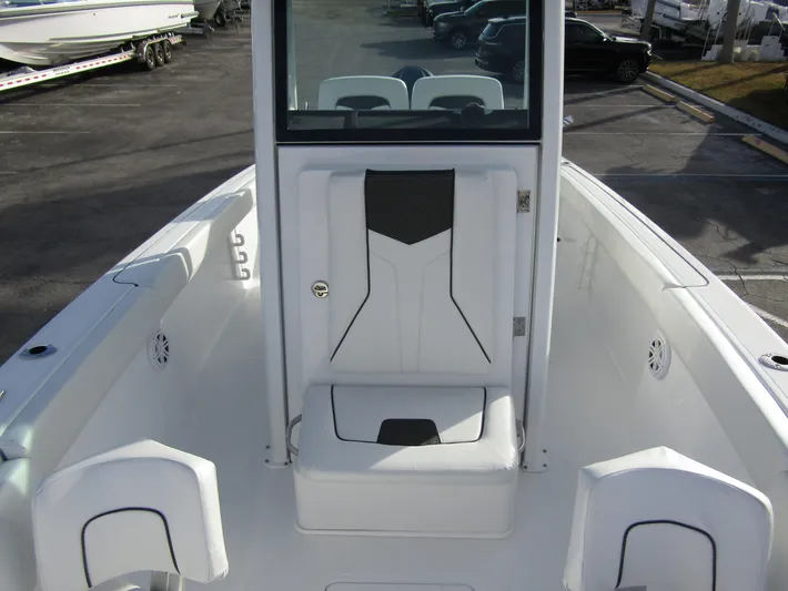  Yacht Photos Pics 2025 Wellcraft 243 Fisherman boat interior, featuring sleek white seating and modern design.