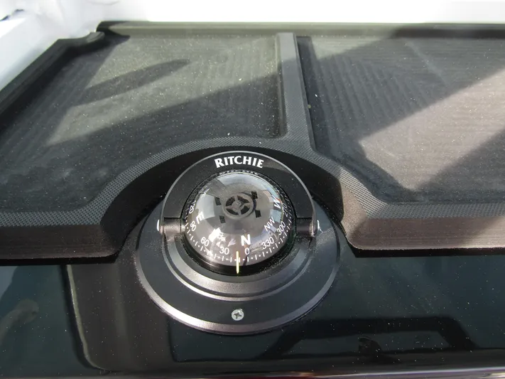  Yacht Photos Pics Ritchie compass on 2025 Wellcraft 243 Fisherman boat dashboard.