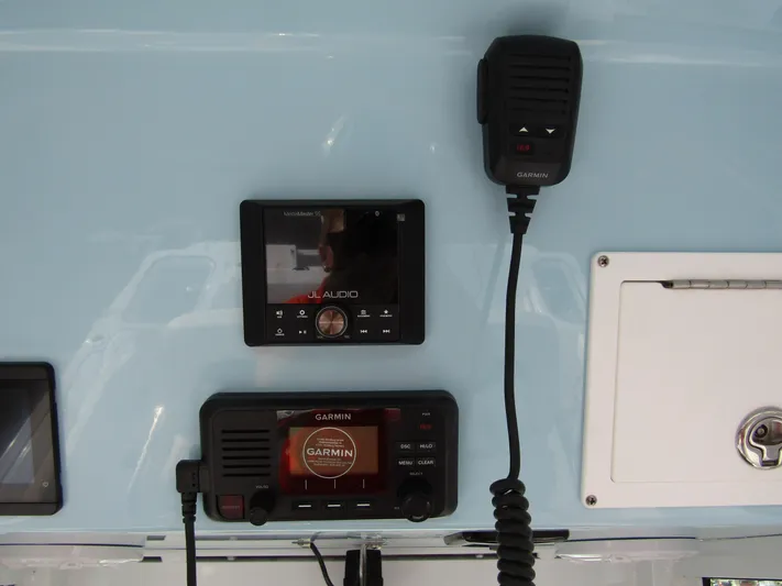  Yacht Photos Pics 2025 Wellcraft 243 Fisherman dashboard with Garmin marine electronics and audio system.