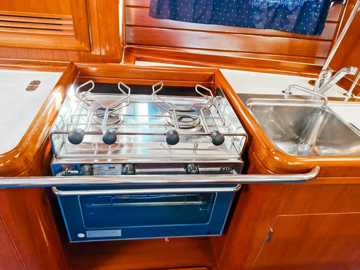  Yacht Photos Pics Galley kitchen in 2004 Beneteau Oceanis 423 yacht with stove and sink.