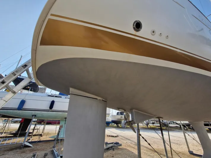  Yacht Photos Pics 2004 Beneteau Oceanis 423 sailboat on dry dock, showcasing hull and keel.