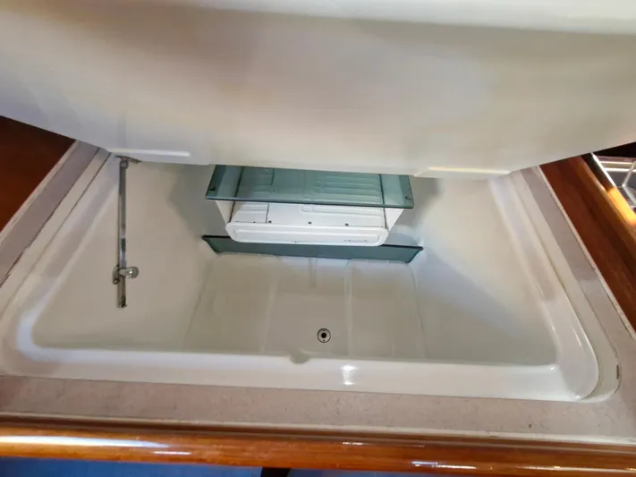  Yacht Photos Pics Open storage compartment in 2004 Beneteau Oceanis 423 yacht interior.