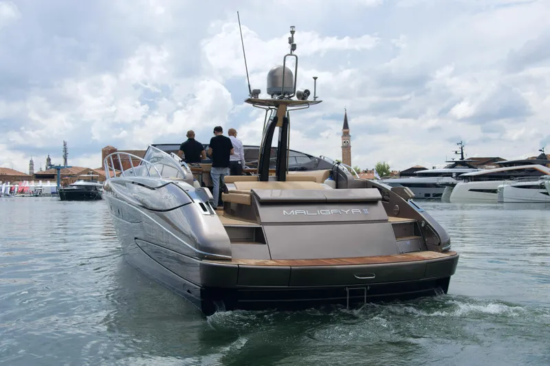  Yacht Photos Pics Luxury Riva Rivale 52 yacht cruising in a marina, 2006 model.