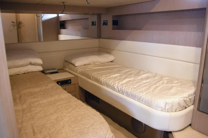  Yacht Photos Pics Interior cabin of 2006 Riva Rivale 52 yacht with twin beds and modern decor.