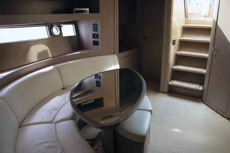  Yacht Photos Pics Interior of 2006 Riva Rivale 52 yacht with elegant seating and stairs.