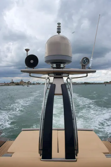  Yacht Photos Pics Riva Rivale 52 yacht, 2006 model, cruising on a cloudy day with visible wake.