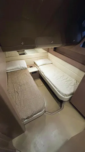  Yacht Photos Pics Interior cabin of 2006 Riva Rivale 52 yacht with twin beds and modern design.