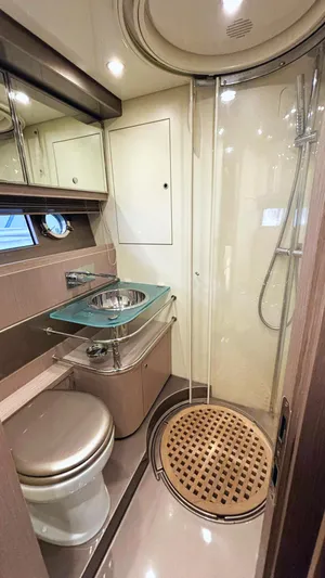  Yacht Photos Pics Luxurious bathroom in 2006 Riva Rivale 52 yacht with modern fixtures and glass shower.