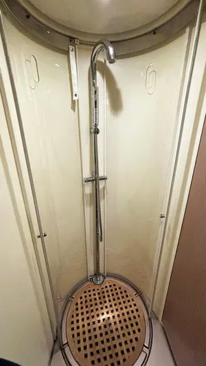  Yacht Photos Pics Shower area in 2006 Riva Rivale 52 yacht with modern fixtures and wooden floor.