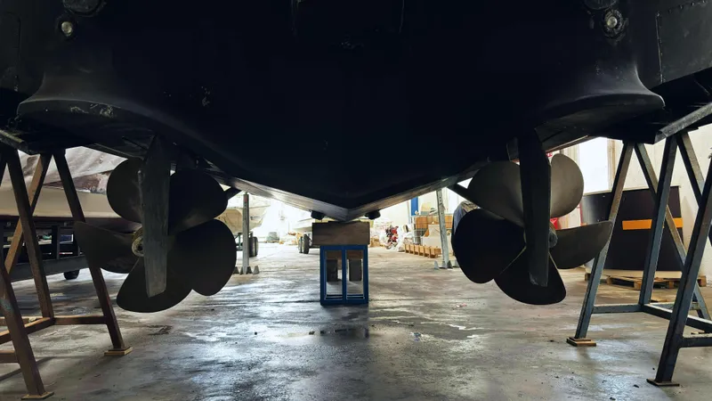 Yacht Photos Pics Underneath view of a 2006 Riva Rivale 52 yacht in a maintenance facility.