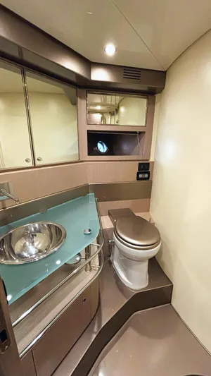  Yacht Photos Pics Luxurious bathroom in 2006 Riva Rivale 52 yacht with modern fixtures and elegant design.