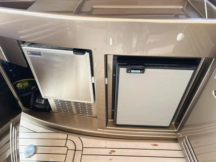  Yacht Photos Pics Riva Rivale 52 yacht, 2006 model, featuring built-in stainless steel appliances on deck.