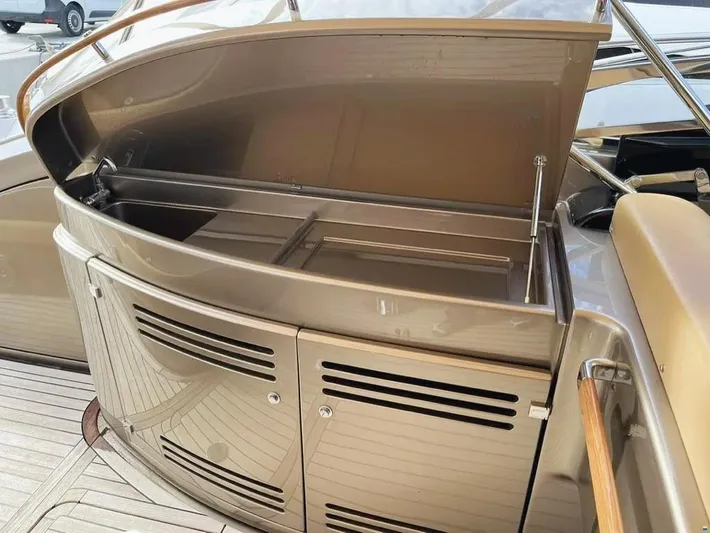  Yacht Photos Pics Open storage compartment on a 2006 Riva Rivale 52 yacht deck.