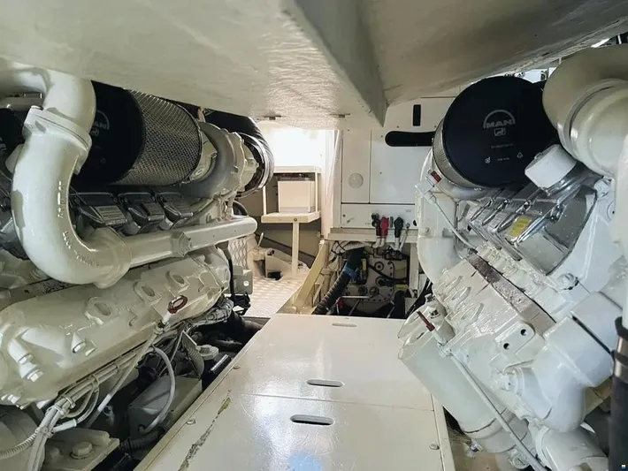  Yacht Photos Pics Engine room of a 2006 Riva Rivale 52 yacht, showcasing dual engines and mechanical components.