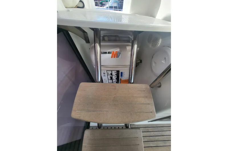  Yacht Photos Pics Staircase on 2018 Fountaine Pajot Saona 47 yacht, featuring wooden steps and storage compartment.