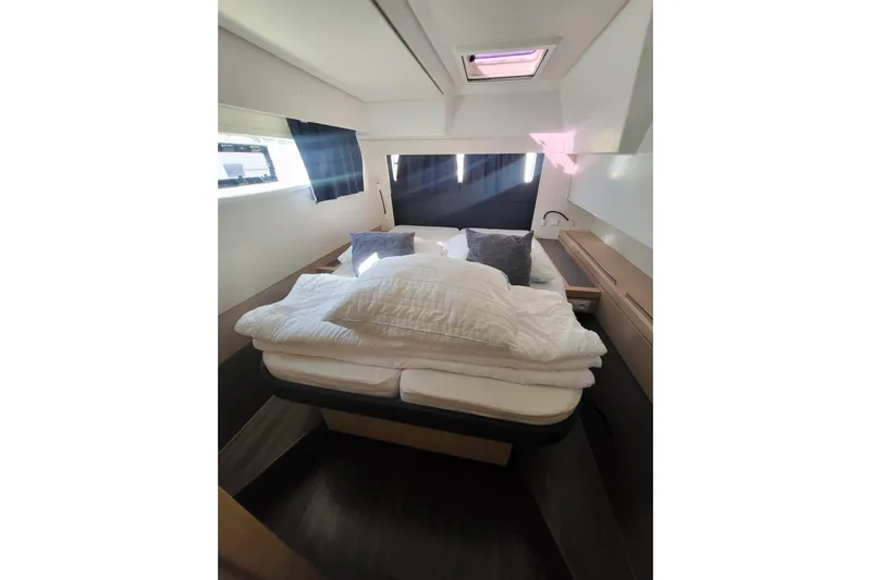  Yacht Photos Pics Luxurious cabin interior of 2018 Fountaine Pajot Saona 47 catamaran with cozy bedding.