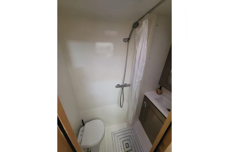  Yacht Photos Pics Bathroom interior of 2018 Fountaine Pajot Saona 47 catamaran, featuring shower and sink.