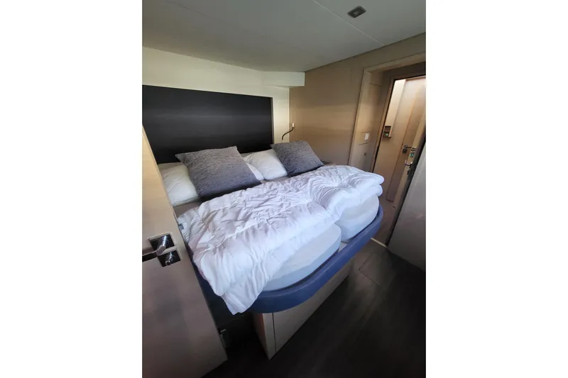  Yacht Photos Pics Cozy bedroom in 2018 Fountaine Pajot Saona 47 yacht with plush bedding and modern design.