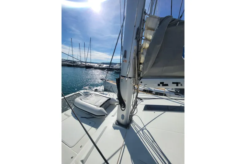  Yacht Photos Pics 2018 Fountaine Pajot Saona 47 catamaran docked in sunny marina.