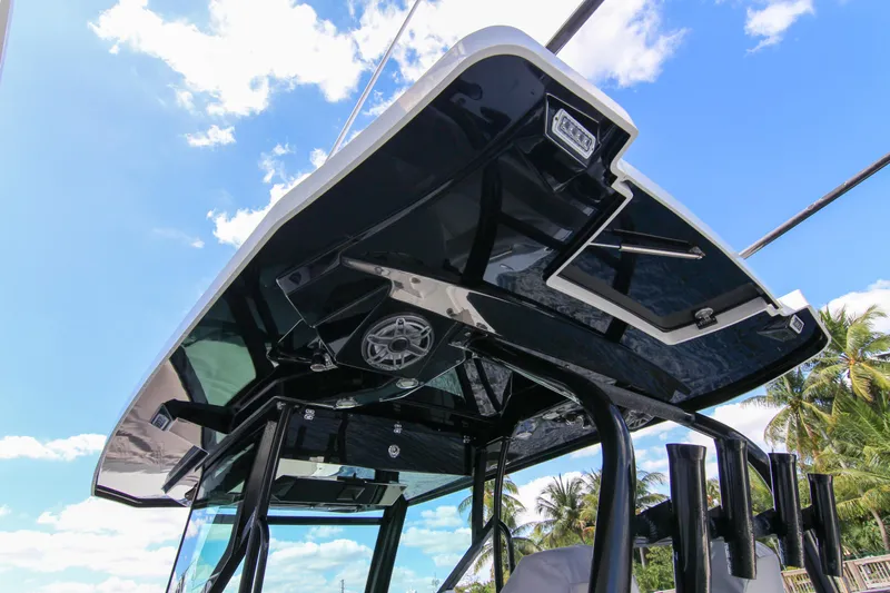  Yacht Photos Pics 2020 Blackfin 332 CC boat's sleek T-top against a bright blue sky.