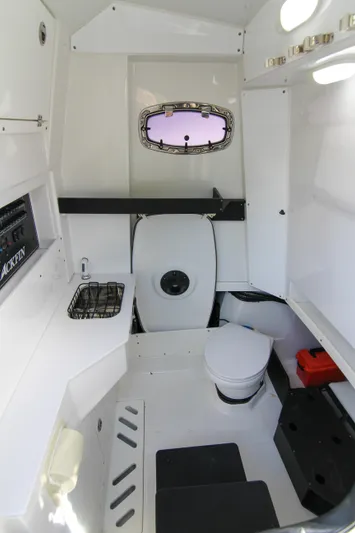  Yacht Photos Pics 2020 Blackfin 332 CC cabin interior with compact toilet and sink, featuring modern design elements.