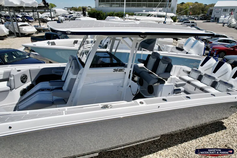 Mundinger Brokerage Yacht Photos Pics 2023 Fountain 34 SC boat with sleek design, spacious seating, and modern features at a marina.