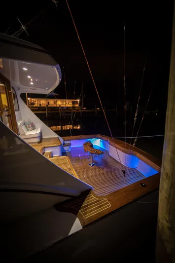 Privateer Yacht Photos Pics 2019 Jarrett Bay 67 Custom yacht at night, illuminated deck, luxury fishing setup.