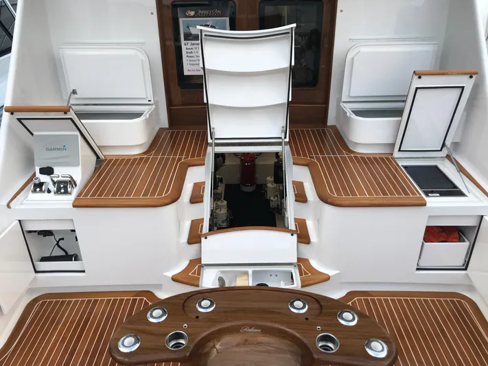 Privateer Yacht Photos Pics 2019 Jarrett Bay 67 Custom yacht deck with teak flooring and open storage compartments.