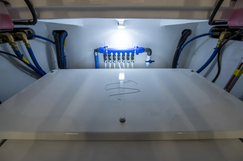 Privateer Yacht Photos Pics Engine room of 2019 Jarrett Bay 67 Custom yacht with illuminated control panel.