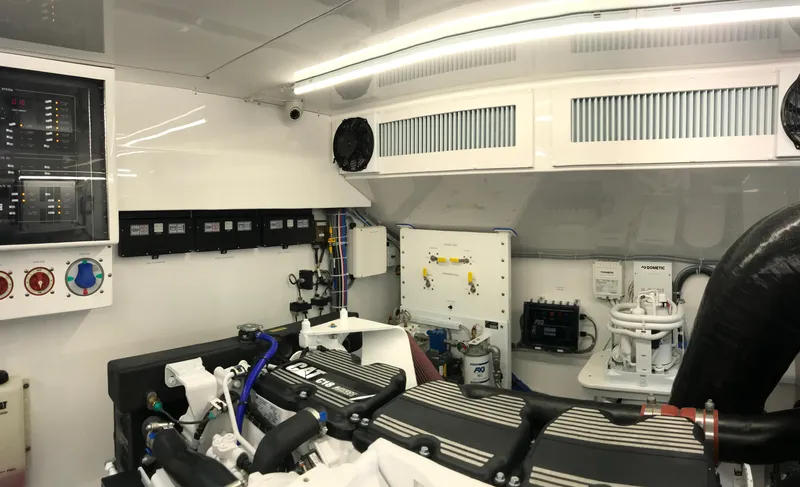 Privateer Yacht Photos Pics Engine room of a 2019 Jarrett Bay 67 Custom yacht with CAT engines and control panels.