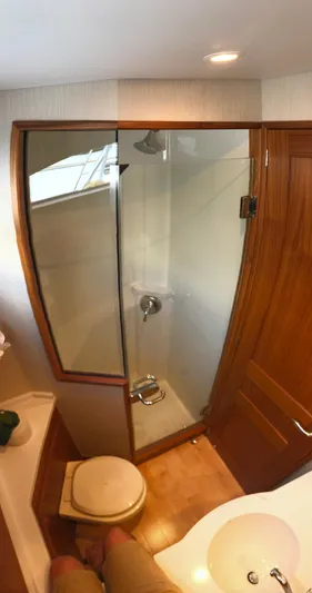 Privateer Yacht Photos Pics Bathroom interior of 2019 Jarrett Bay 67 Custom yacht with shower, toilet, and sink.