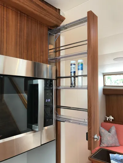 Privateer Yacht Photos Pics Jarrett Bay 67 Custom 2019 yacht interior with wooden cabinetry and built-in microwave.