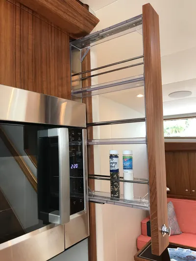 Privateer Yacht Photos Pics Pull-out spice rack in 2019 Jarrett Bay 67 Custom yacht kitchen.