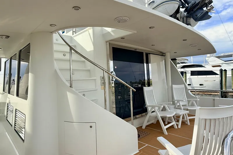 Southern Lady Yacht Photos Pics 2002 Cheoy Lee 72 Raised Pilot House Motor Yacht deck with chairs and staircase.