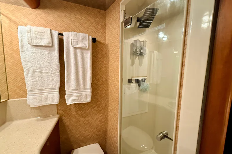 Southern Lady Yacht Photos Pics Luxurious bathroom in 2002 Cheoy Lee 72 Raised Pilot House Motor Yacht.