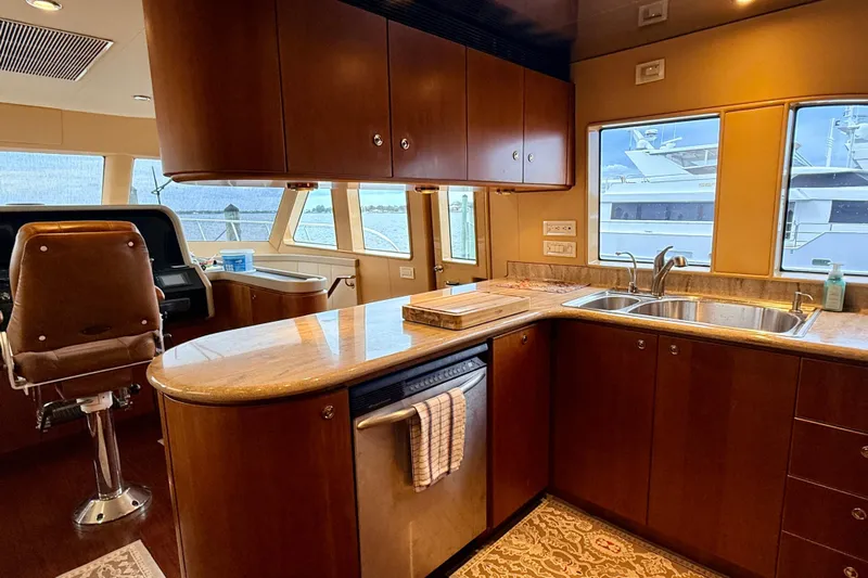 Southern Lady Yacht Photos Pics Luxurious kitchen interior of 2002 Cheoy Lee 72 Raised Pilot House Motor Yacht.