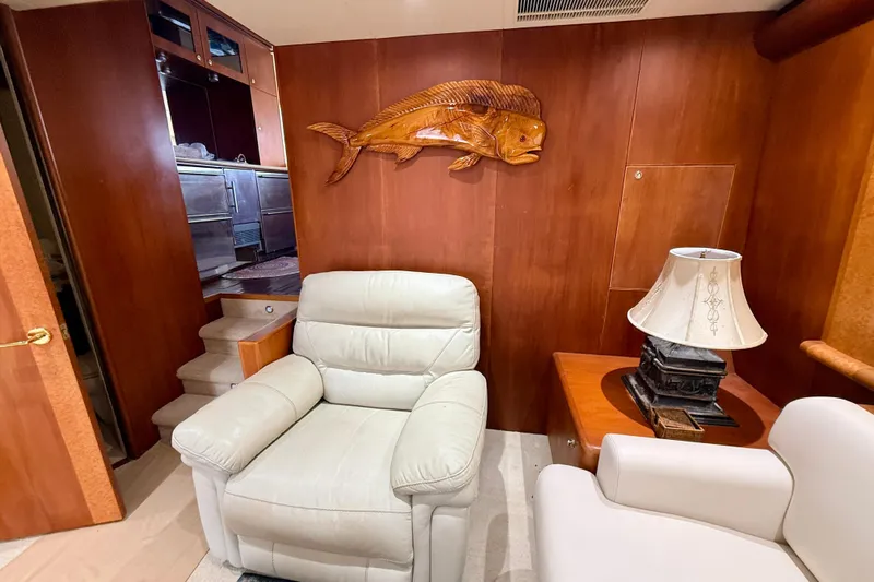 Southern Lady Yacht Photos Pics Luxurious interior of 2002 Cheoy Lee 72 yacht with leather seating and wooden decor.