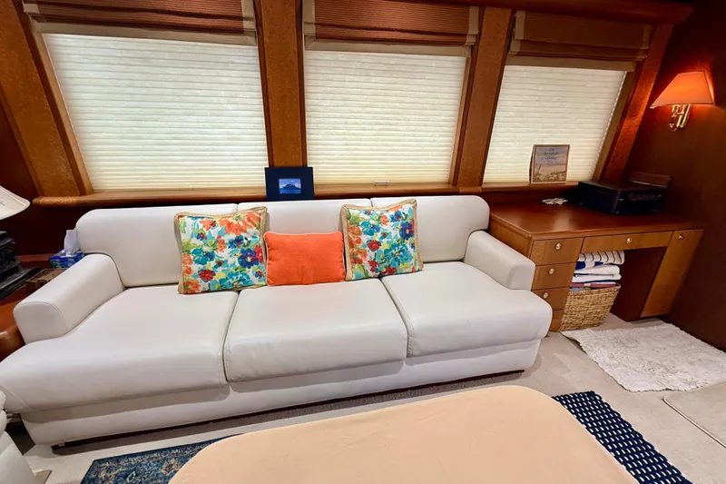 Southern Lady Yacht Photos Pics Luxurious interior of 2002 Cheoy Lee 72 Yacht with elegant sofa and vibrant cushions.