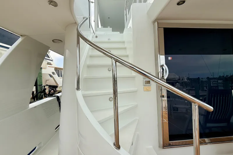 Southern Lady Yacht Photos Pics Staircase on 2002 Cheoy Lee 72 Raised Pilot House Motor Yacht, featuring sleek design and polished railing.