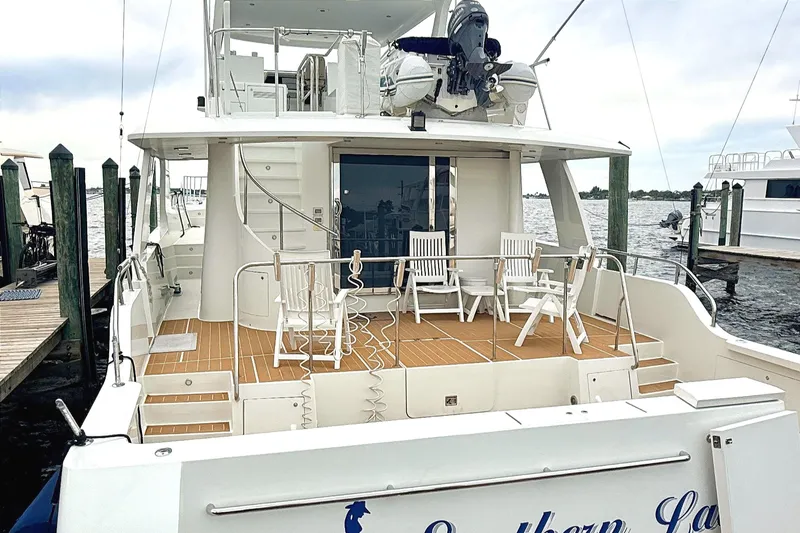 Southern Lady Yacht Photos Pics 2002 Cheoy Lee 72 Raised Pilot House Motor Yacht docked, featuring spacious deck and seating area.