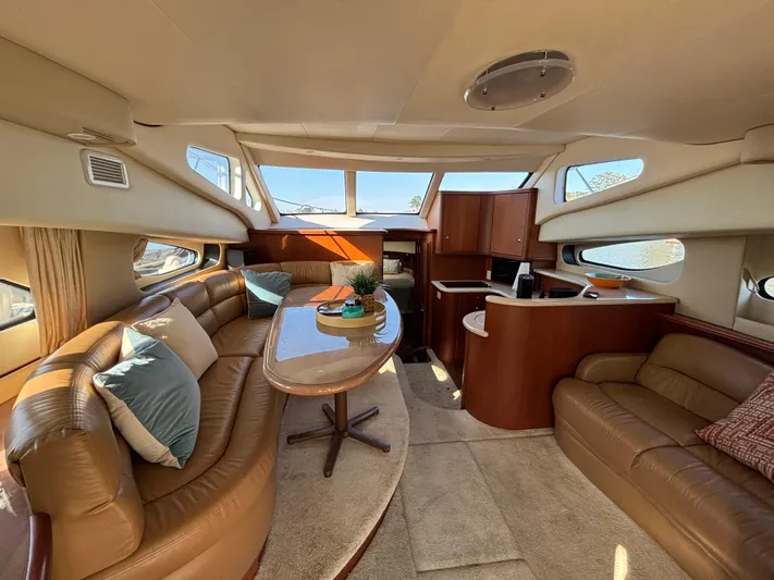 Kong Yacht Photos Pics Luxurious interior of 2005 Silverton 38 Sport Bridge yacht with plush seating and elegant design.