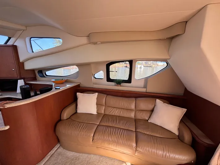 Kong Yacht Photos Pics Interior of 2005 Silverton 38 Sport Bridge yacht with leather sofa and windows.